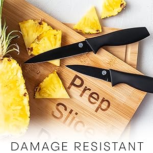 Knives on board with pineapple